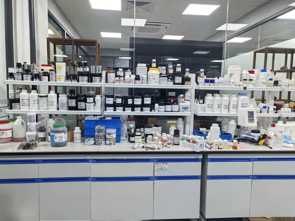 Industrial UV adhesive laboratory, technicians testing industrial glue bonding performance
