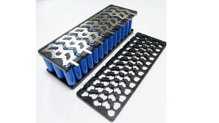 Precision application of thermal conductive potting glue on micro-battery components for heat dissipation and protection.
